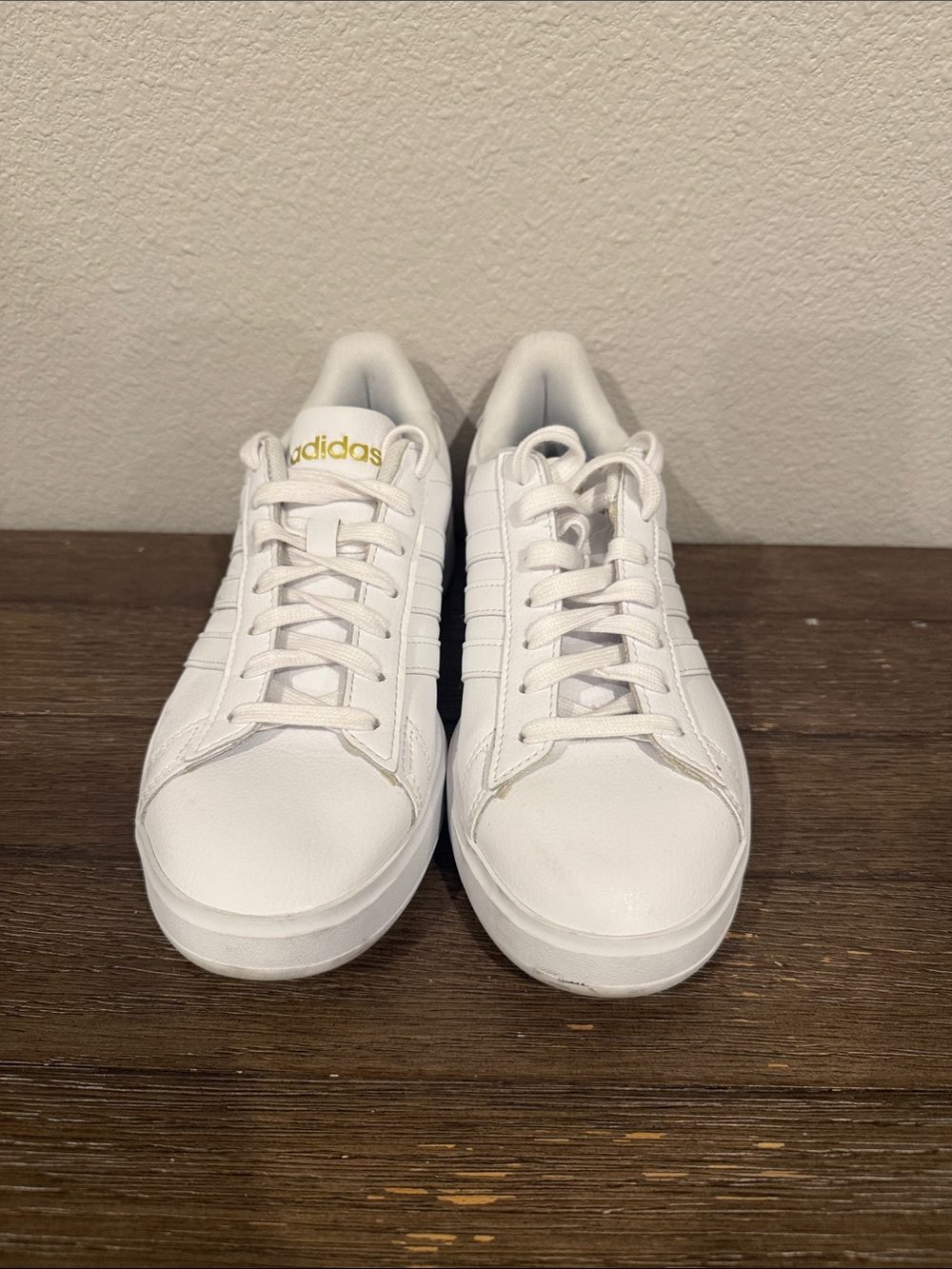 adidas White Low-Top Leather Sneakers with Gold Accent